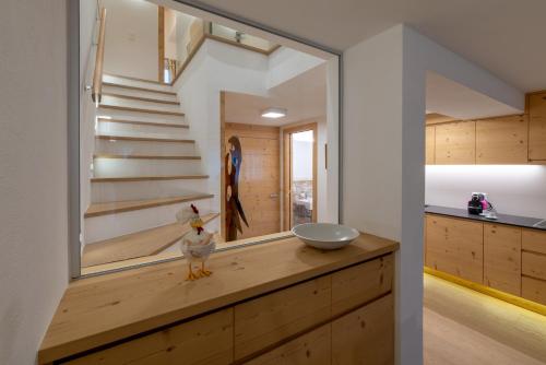 a house with a chicken on a counter in a kitchen at Chesa Silvretta Duplex in Celerina