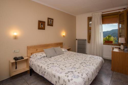 Posteľ alebo postele v izbe v ubytovaní Hostal Montserrat