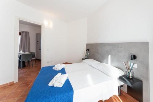 Postel nebo postele na pokoji v ubytování Residence Rocce Rosse
