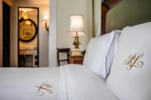 Ένα ή περισσότερα κρεβάτια σε δωμάτιο στο Royal Livingstone Hotel by Anantara