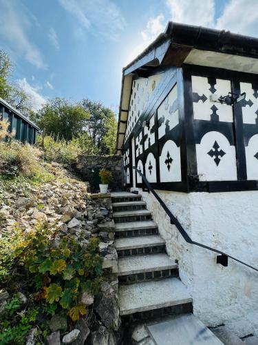 a set of stairs leading up to a building at Pentre Cerrig Country House in Llanferres