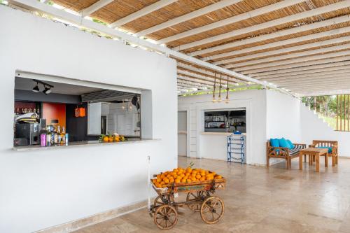 a room with a cart with oranges in it at Grand Viking Hotel in Kemer