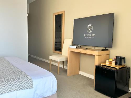 Ένα ή περισσότερα κρεβάτια σε δωμάτιο στο Hotel Revellata & Spa