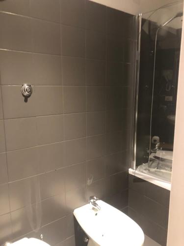 a bathroom with a toilet and a shower at Guest House Prime Palace in Rome