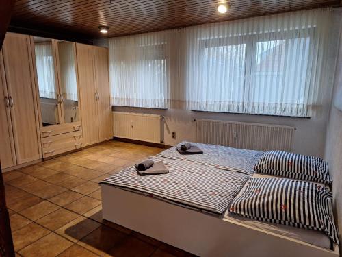 a bedroom with a bed with two towels on it at Apartment 2 Etagen in Duisburg