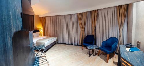 Letto o letti in una camera di WestDoor Hotel