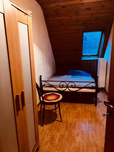a small room with a bed and a chair at Private room in innerstadt graz in Graz