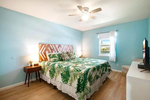 a bedroom with a bed and a ceiling fan at Large 2BR Across From Beach & 5 Min From Hangout in Gulf Shores