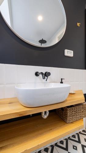 a bathroom with a white sink and a mirror at Relax Cabins in Cristian