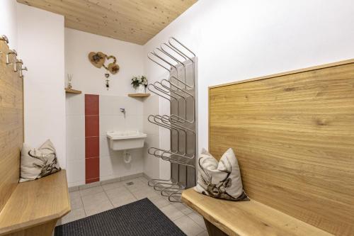 a bathroom with a toilet and a sink at Apartments Soval in Santa Cristina in Val Gardena