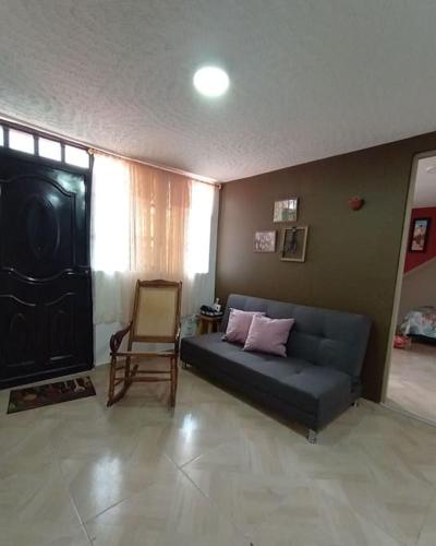 a living room with a couch and a chair at Agradable Apto San Luis in Bucaramanga