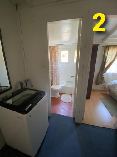 a room with a bathroom with a sink and a toilet at Departamentos Puerto Montt in Puerto Montt