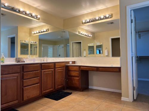 a bathroom with two sinks and a large mirror at Peaceful Oasis 4 bedroom in Summerlin close to Redrock in Las Vegas