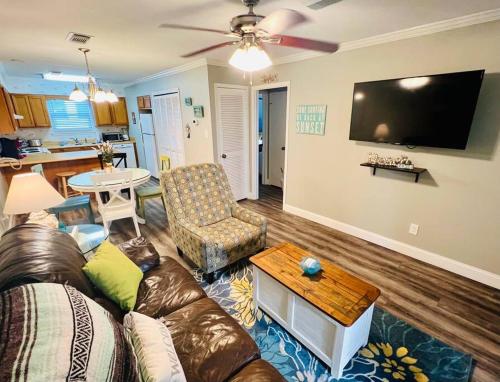 a living room with a couch and a table at Deeded Beach Access- 10 min Walk to Hangout in Gulf Shores