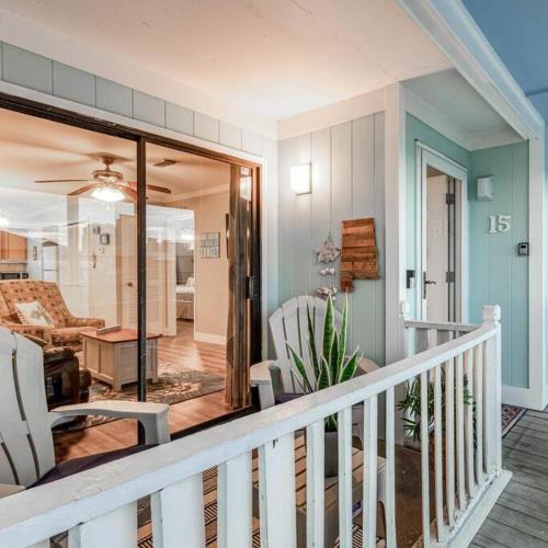 a house with a balcony with chairs and a living room at Deeded Beach Access- 10 min Walk to Hangout in Gulf Shores