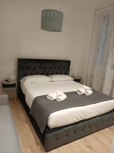 Ένα ή περισσότερα κρεβάτια σε δωμάτιο στο Harmony in Rome