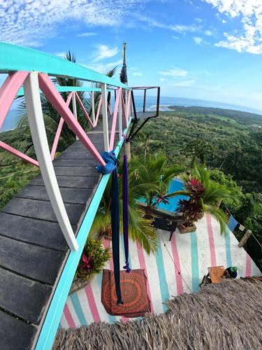 a staircase leading up to a resort with a view at Puerto Alto Hostel in Santa Marta