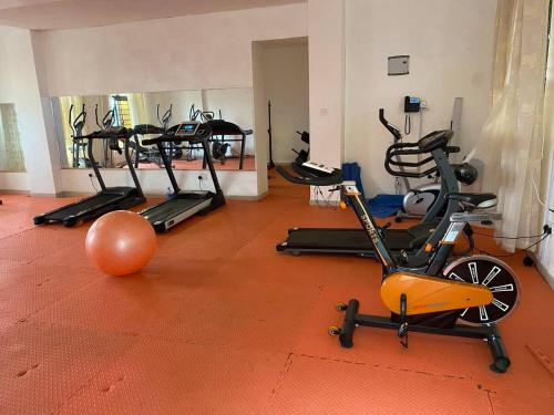 a gym with several exercise bikes in a room at MUCHIE HOMES in Nairobi