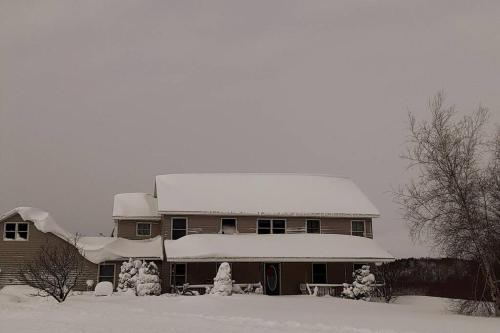 a house with snow on the top of it at Tug Hill Paradise, Copenhagen, NY in Copenhagen