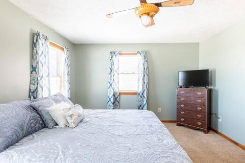 a bedroom with a bed and a television and a dresser at Tug Hill Paradise, Copenhagen, NY 