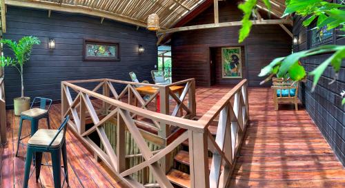 a wooden porch with a wooden bridge in a house at The Lodge at Punta Rica- Hilltop Eco-Lodge with Views & Pool in Bastimentos