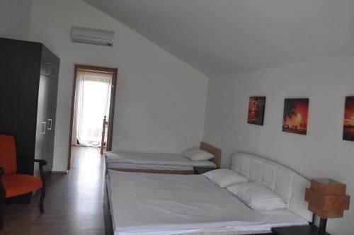 a living room with two beds and a couch at Arena Hotel Goygol in Xanlar