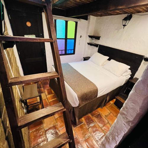 Ένα ή περισσότερα κρεβάτια σε δωμάτιο στο Hotel Boutique Samay