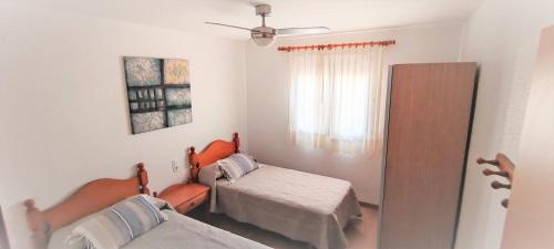 Katil atau katil-katil dalam bilik di Residencial Olival-Acceso privado playa por jardín