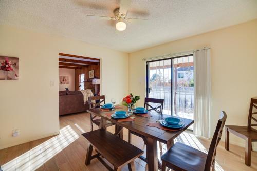 a dining room with a wooden table and chairs at Adobe Home in Albuquerque with Covered Patio in Albuquerque