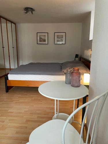a small room with a bed and a table at The Vineyard View in Zell an der Mosel