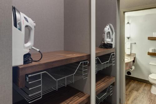 a bathroom with a sink and a toilet in a room at Hilton Garden Inn Sacramento/South Natomas in Sacramento
