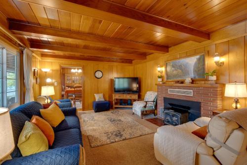 a living room with a couch and a fireplace at Game Room and Patio Charming Jackson Retreat! in Jackson