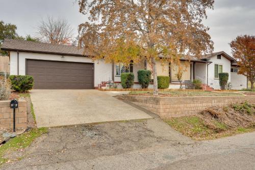a house with a driveway and a garage at Game Room and Patio Charming Jackson Retreat! in Jackson