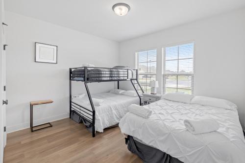 Ένα ή περισσότερα κρεβάτια σε δωμάτιο στο Sugarcane Dreamscape in Iowa, LA