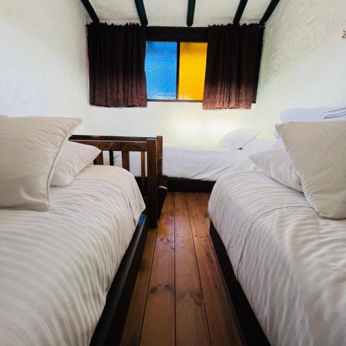 Ένα ή περισσότερα κρεβάτια σε δωμάτιο στο Hotel Boutique Samay