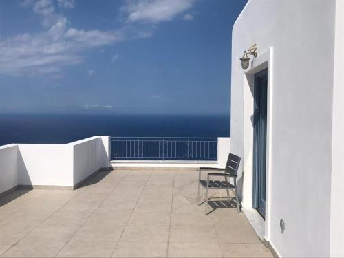a balcony with a view of the ocean at Aegean Mirror, Andros in Apróvaton