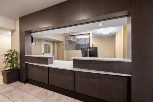 a lobby with a reception desk in a hospital at Candlewood Suites Bismarck in Bismarck