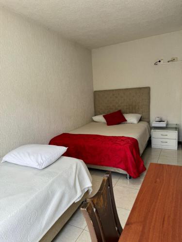 Katil atau katil-katil dalam bilik di Hotel La Candelaria
