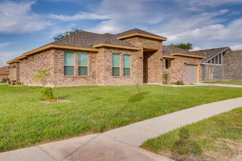 a brick house with a green lawn in front of it at WFH-Friendly Brownsville Home with Private Patio in Brownsville