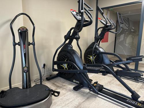 a gym with two exercise bikes in a room at Skałka Zieleniec in Duszniki Zdrój