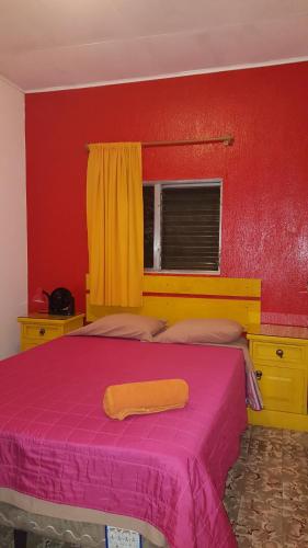 Una cama o camas en una habitación de Margaritas Hostel