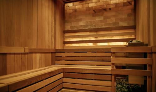 a sauna with wooden walls and wooden floors and avisor at Cozy Mountain View Condo in Vernon Township