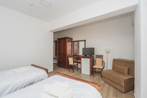 Una cama o camas en una habitación de Hotel Pharos
