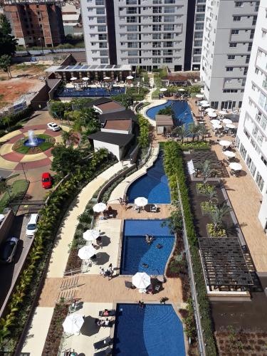 an aerial view of a resort with pools and umbrellas at Encontro das Águas e Evian Caldas Novas in Caldas Novas