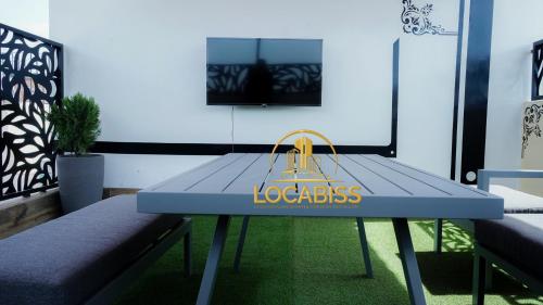 a blue table with a yellow bag on it at LOCABISS in Rufisque