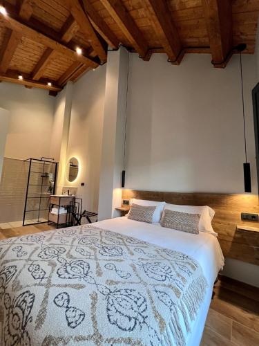 a bedroom with a large bed in a room at Aldea Rural y Gastro Restaurante Casona de Labrada in Labrada
