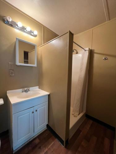 a bathroom with a sink and a shower at Extended Stay of Carrizo Springs in Carrizo Springs