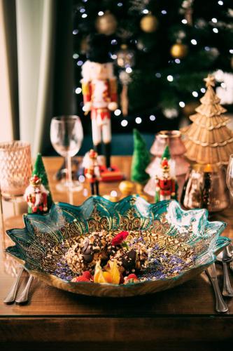 a plate of food on a table with christmas decorations at Hotel Kotarz Spa&Wellness in Brenna