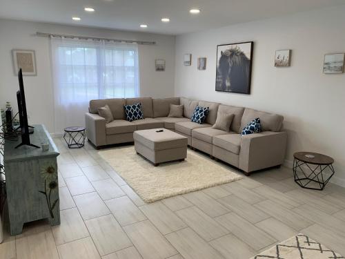 a living room with a couch and a table at Newly remodeled 2br, 2ba condo in Naples Bath and Tennis in Naples