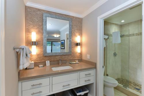 a bathroom with a sink and a mirror at High-end Getaway Suite at Silverado in Napa